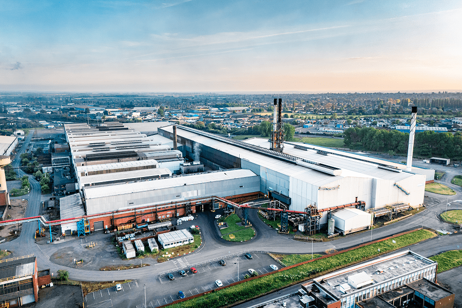 Factory complex with parking and green areas